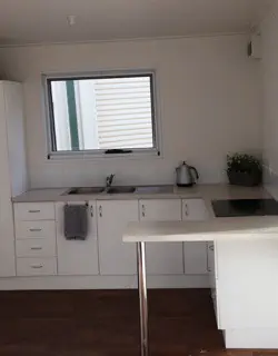 White kitchen layout in a park cabin