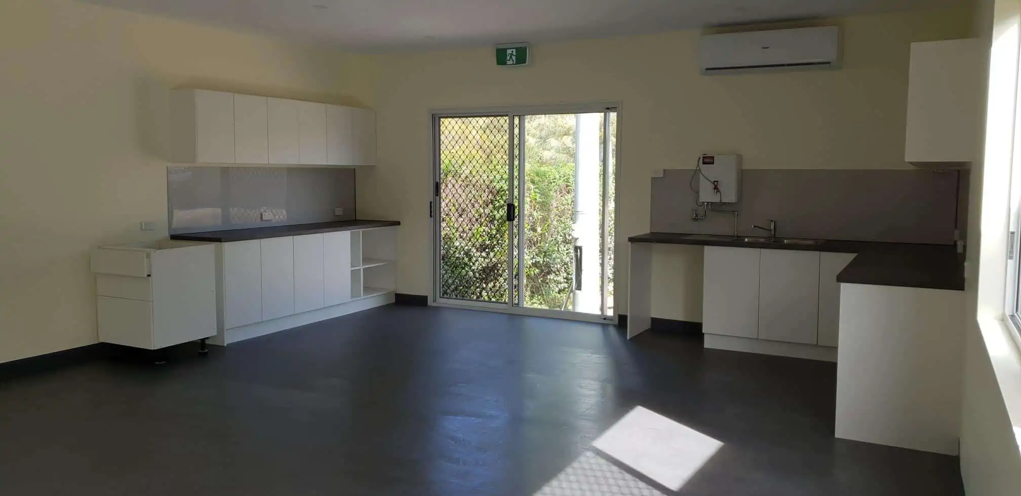 Empty kitchen and living area in a workers accommodation modular